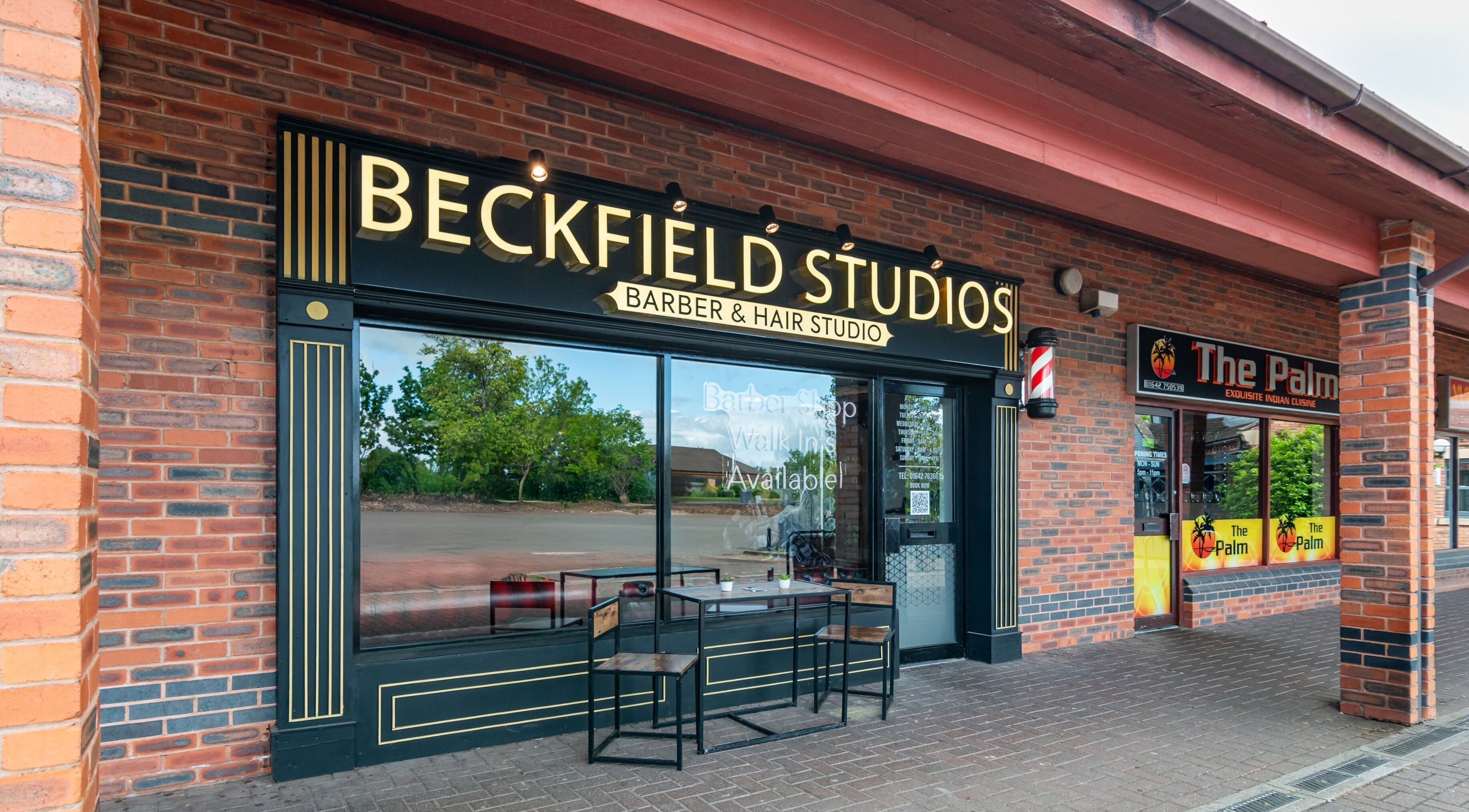 Exterior of Beckfield Studios in Thornaby, England, showcasing its stylish barber shop entrance.