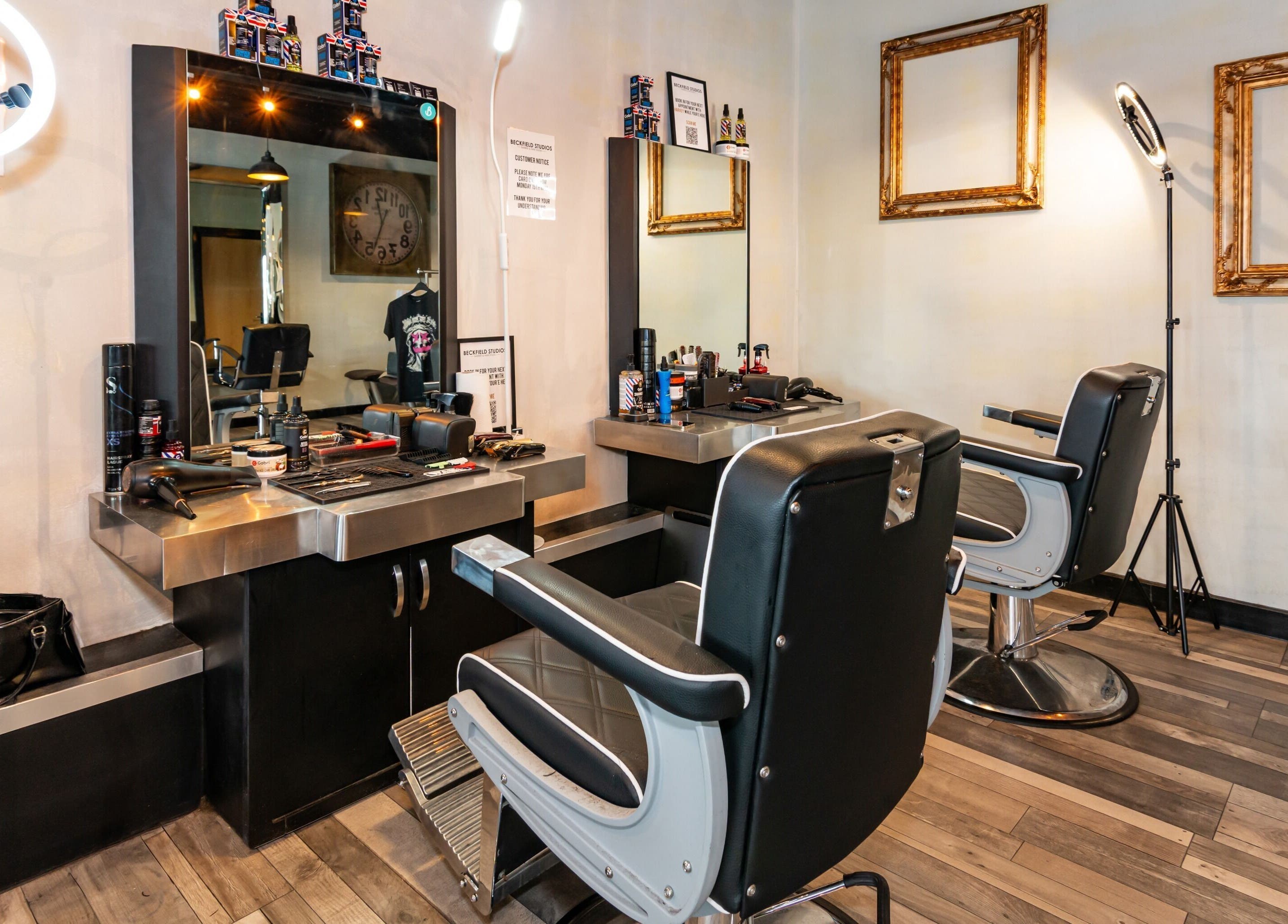 Modern barber stations at Beckfield Studios, Thornaby, England, GB with stylish leather chairs and mirrors.