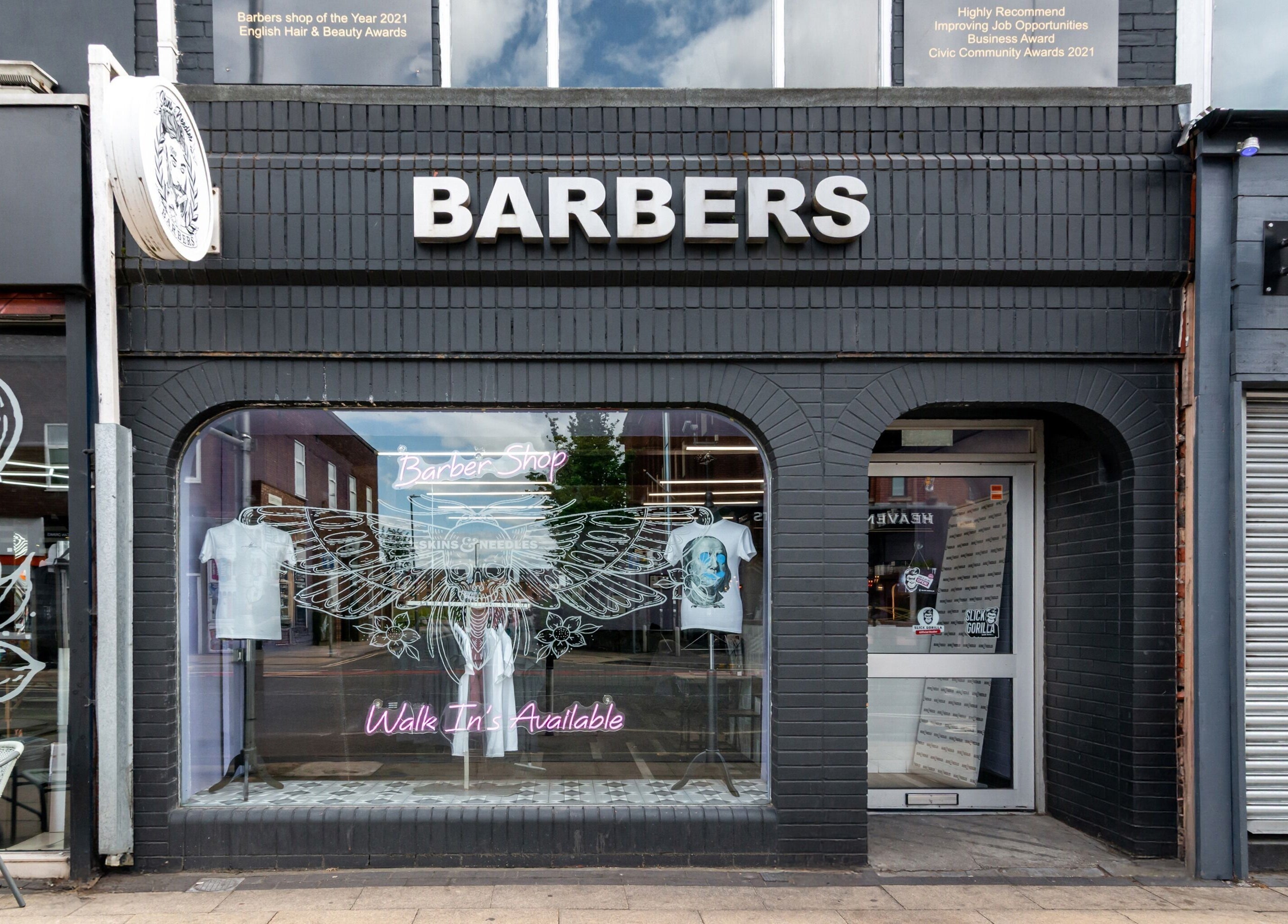 Skins & Needles Barbers storefront in Middlesbrough, England, GB, showcasing stylish exterior with signage.