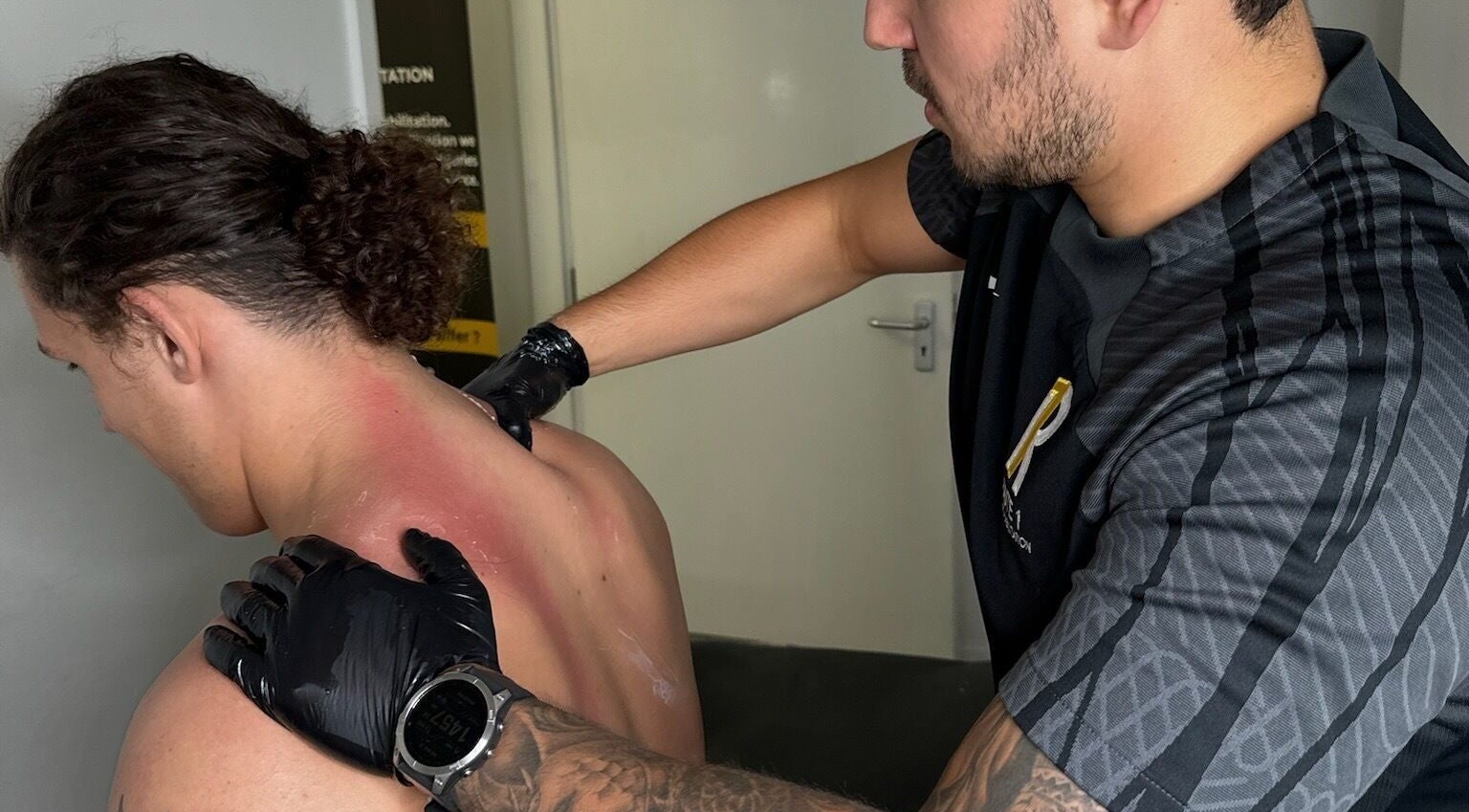 Therapist providing back treatment at Route 1 Sports Rehabilitation, Worsley, England, GB.