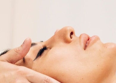 Relaxing facial treatment at ELEVATE in Bellmore, New York, US, showcasing a peaceful spa experience.