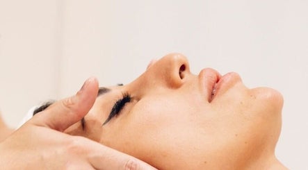 Relaxing facial treatment at ELEVATE in Bellmore, New York, US, showcasing a peaceful spa experience.