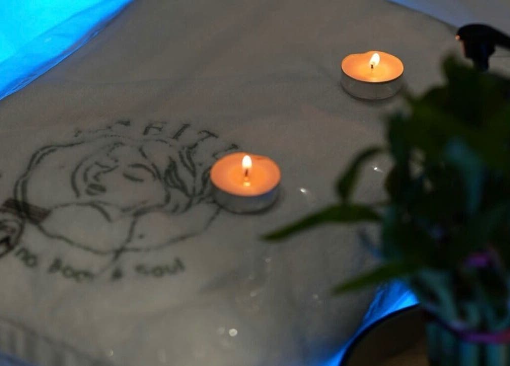 Cozy candles on a towel at Aceituna Beauty Salon L.L.C, Dubai, Dubai, AE, creating a relaxing ambiance.