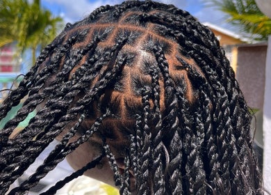 Intricate braids styled at BraidedbyZy in Saint James, BB, showcasing expert hairstyling skills.