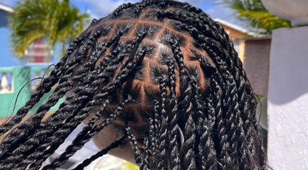 Intricate braids styled at BraidedbyZy in Saint James, BB, showcasing expert hairstyling skills.