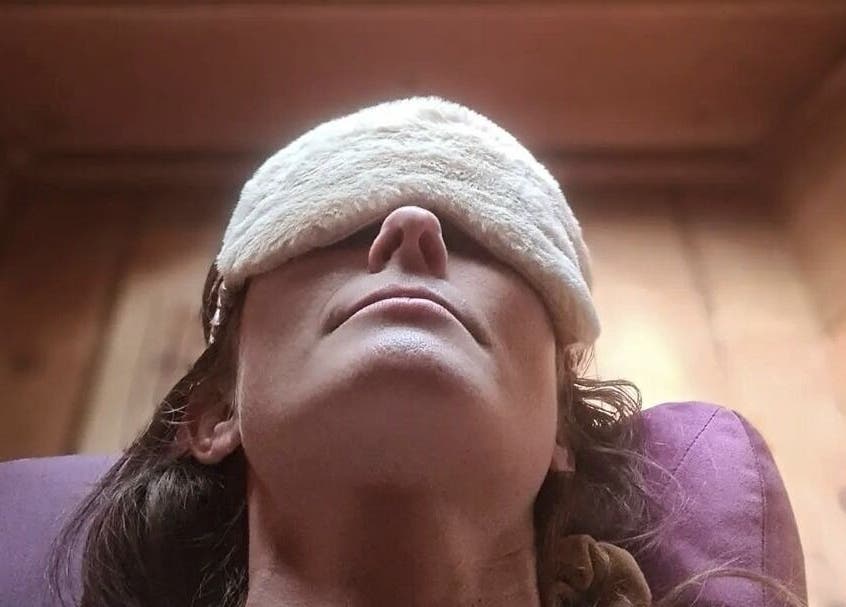 Relaxing spa experience at Bee Alive in Mullumbimby, New South Wales, AU. Person enjoying tranquility with eye mask.