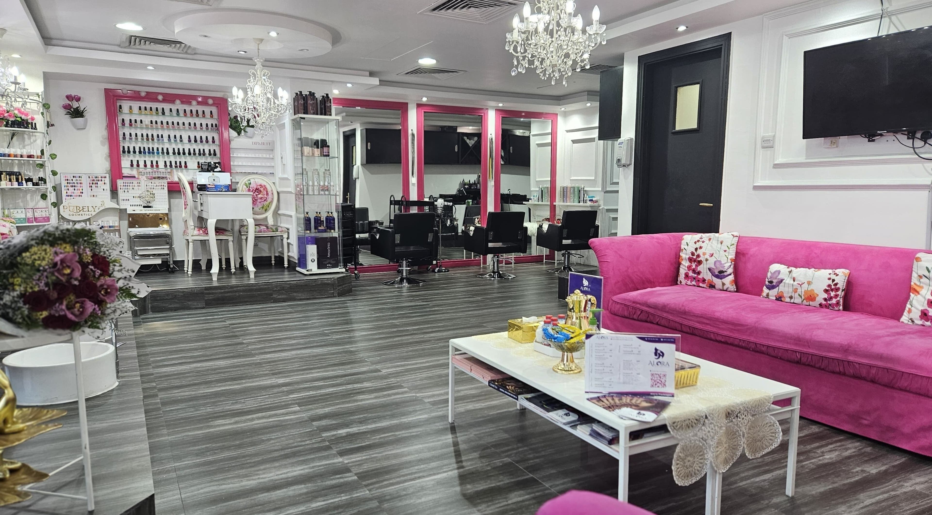Modern interior of Alora Beauty Center, Abu Dhabi, featuring elegant decor with vibrant pink accents.