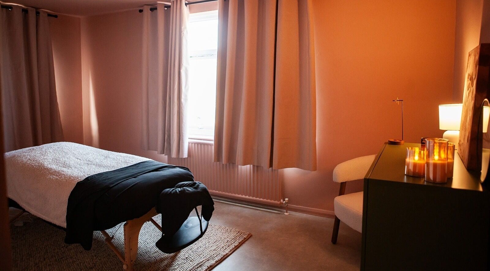 Relaxing massage room at The Deep House Hertford, Hertford, England, GB with warm lighting and serene decor.