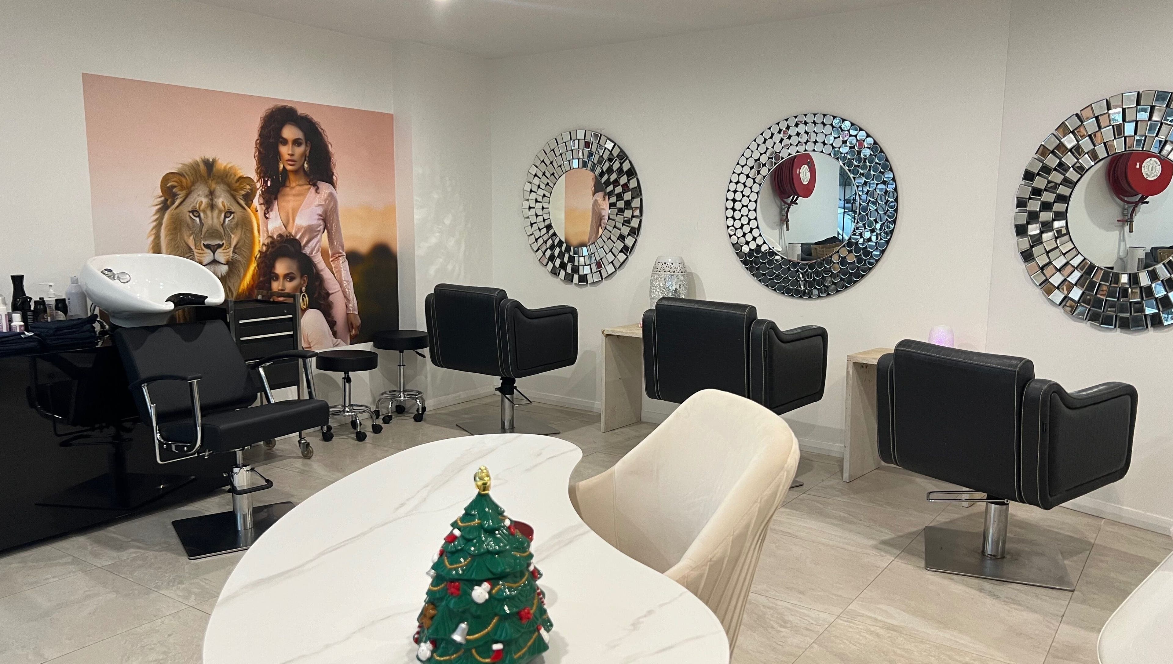 Elegant salon interior at Mane Glow Curls and Extensions, Petersham, New South Wales, AU with stylish chairs and mirrors.