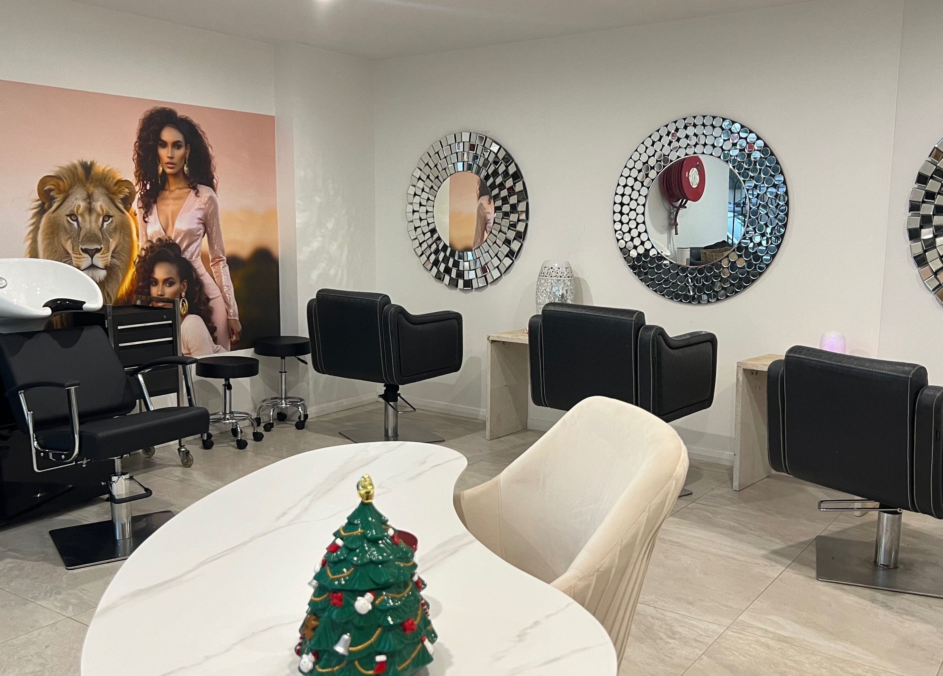 Elegant salon interior at Mane Glow Curls and Extensions, Petersham, New South Wales, AU with stylish chairs and mirrors.