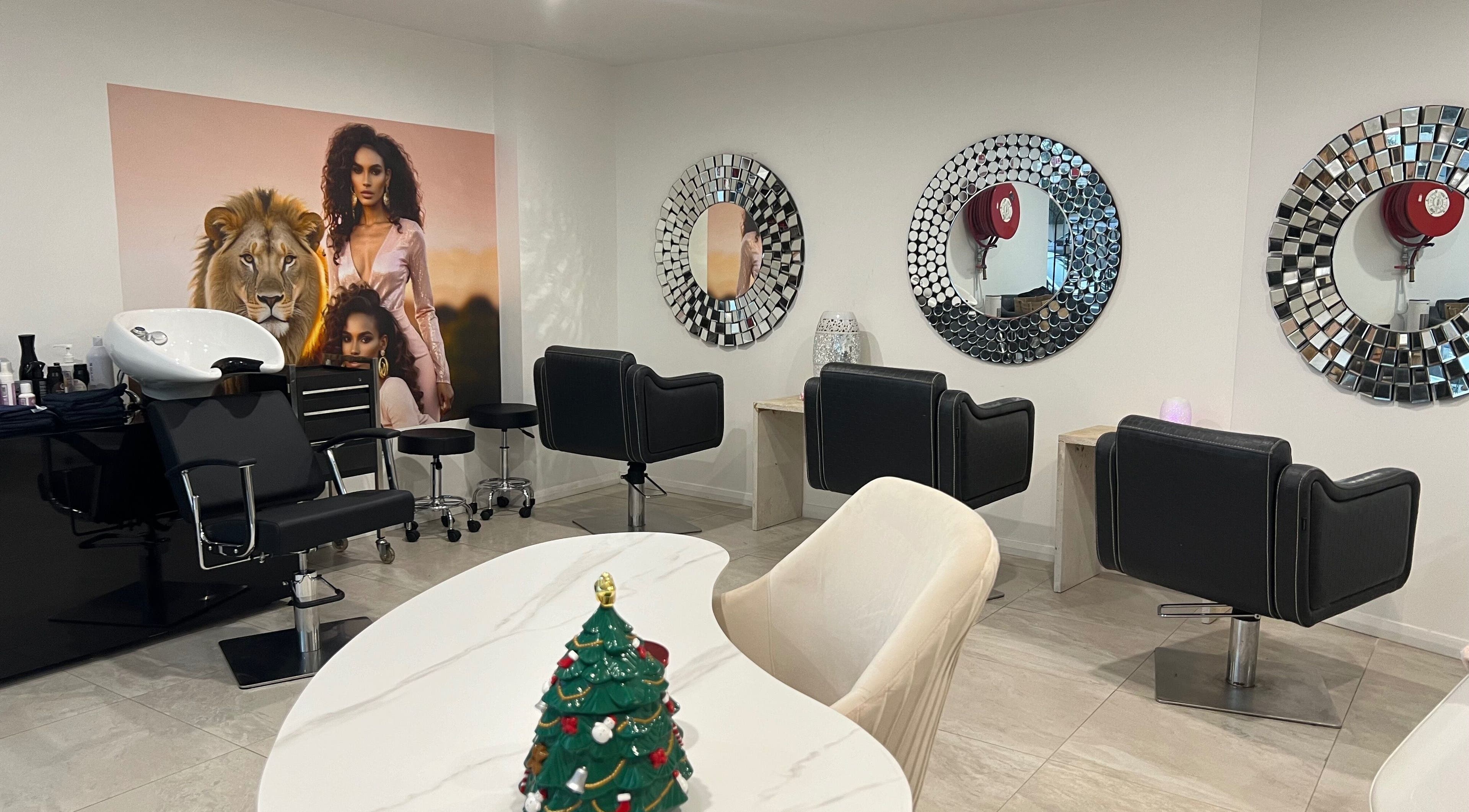 Elegant salon interior at Mane Glow Curls and Extensions, Petersham, New South Wales, AU with stylish chairs and mirrors.