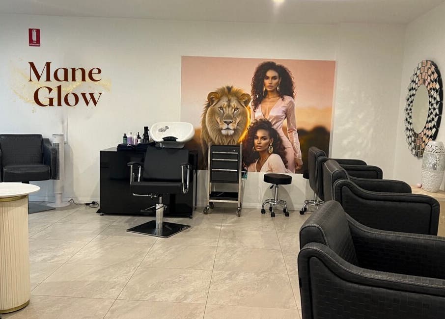 Interior of Mane Glow Curls and Extensions in Petersham, New South Wales, AU, featuring chic salon chairs and decor.