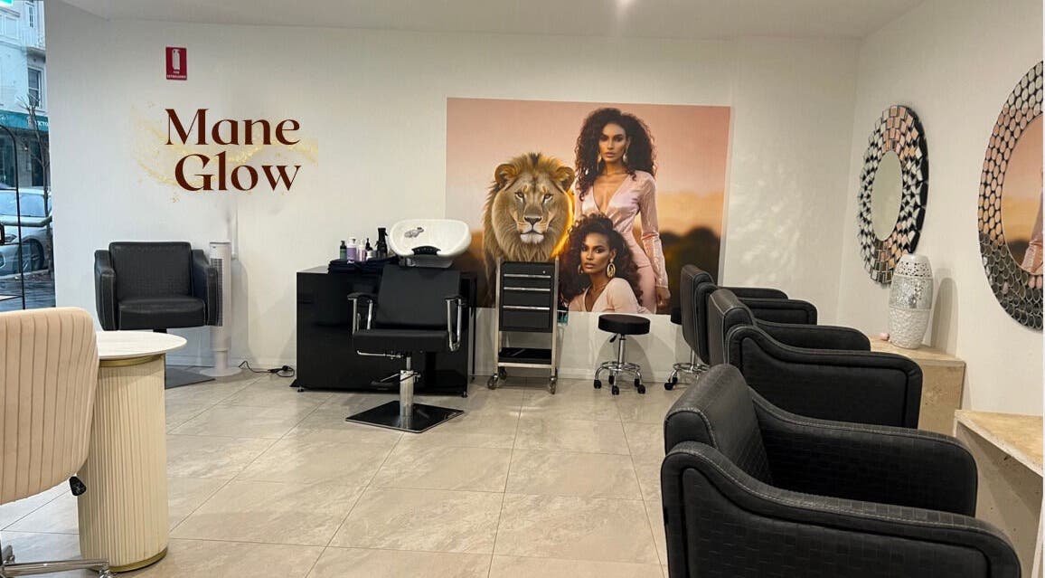 Interior of Mane Glow Curls and Extensions in Petersham, New South Wales, AU, featuring chic salon chairs and decor.