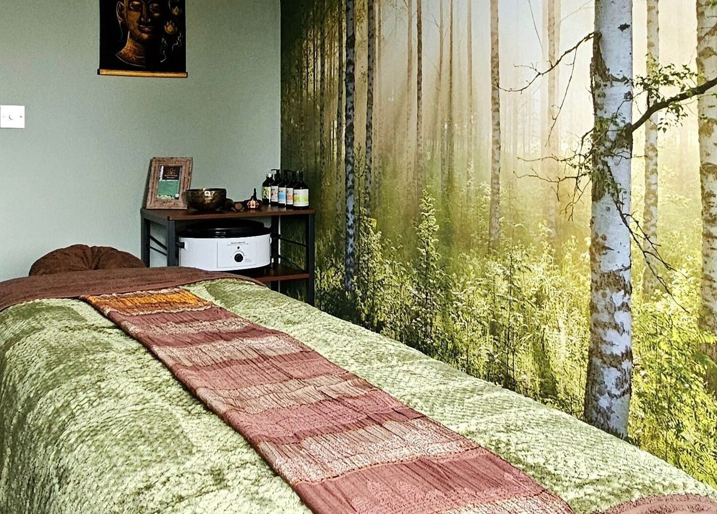 Peaceful massage room at Forest Massage Therapies in Saint Helens, England, GB with forest-themed decor.