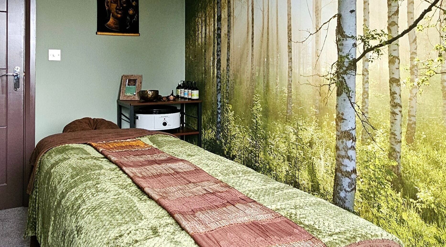 Peaceful massage room at Forest Massage Therapies in Saint Helens, England, GB with forest-themed decor.