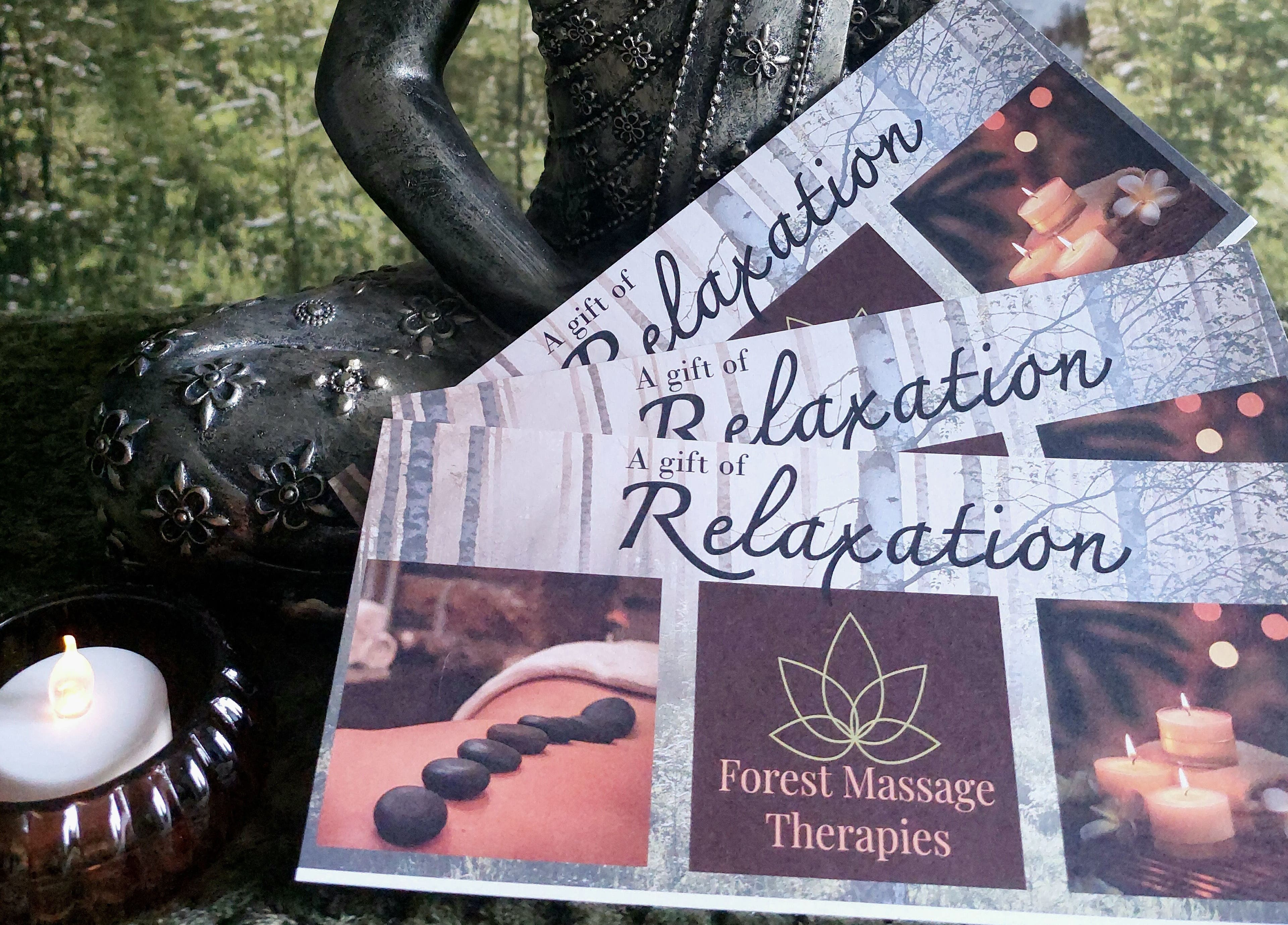Gift vouchers featuring candles and stones at Forest Massage Therapies, Saint Helens, England, GB.