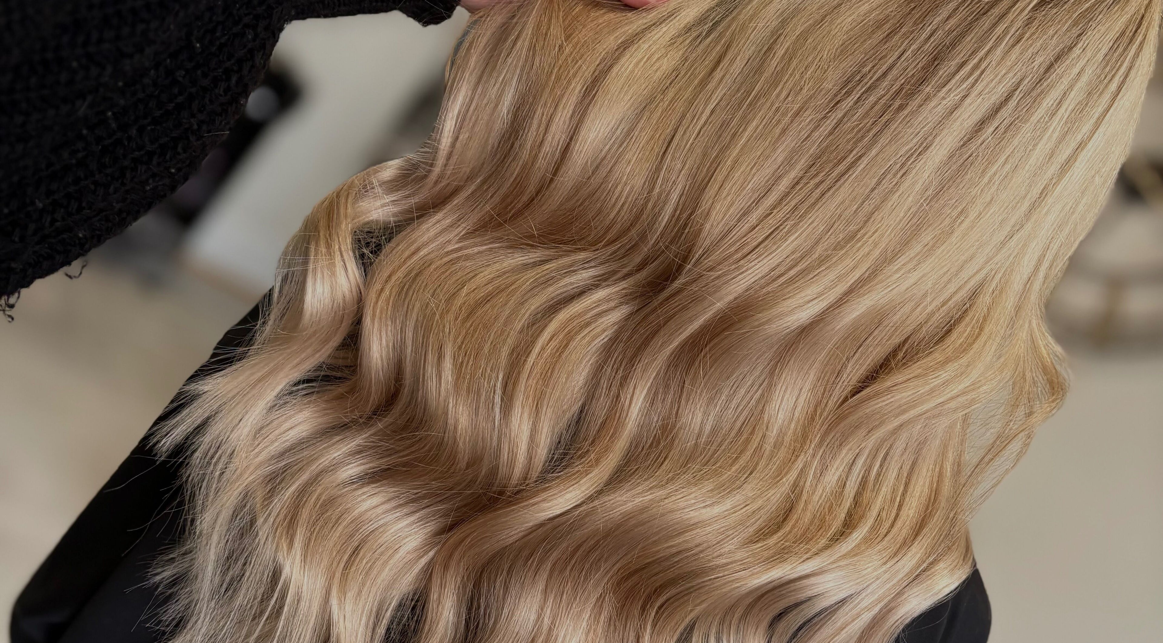 Golden wavy hair styled at Hair Glow by Millie, Elland, England, GB for a radiant look.