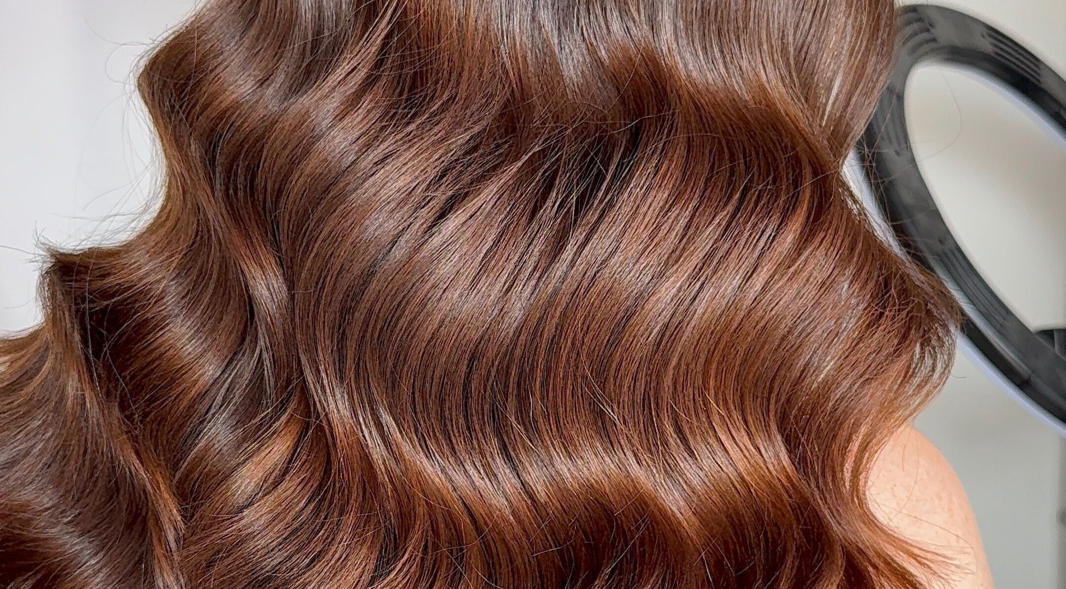 Glossy brown hair waves styled at Hair with K, Rockdale, New South Wales, AU.