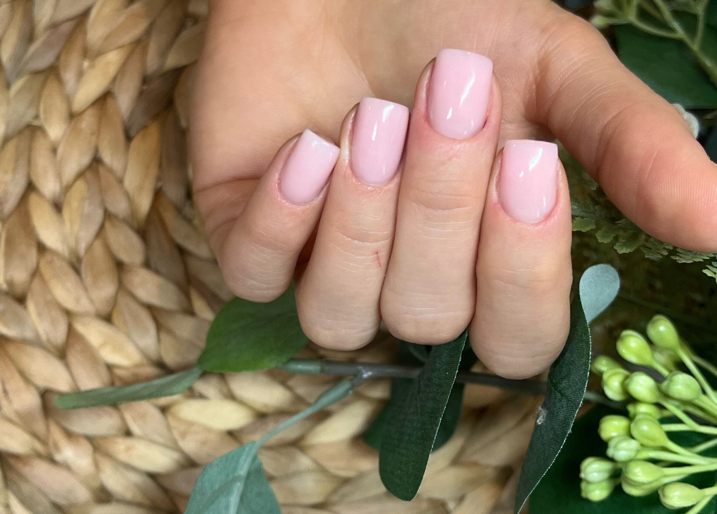 Perfect pink manicure at Classy Nails & Brows in Celbridge, County Kildare, IE. Lush greenery complements the nails.