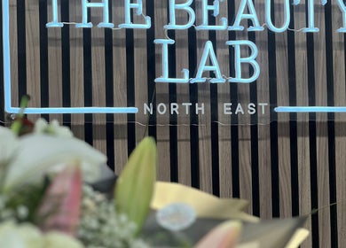 Stylish neon sign at The Beauty Lab North East South Shields, South Shields, England, GB with floral decor.