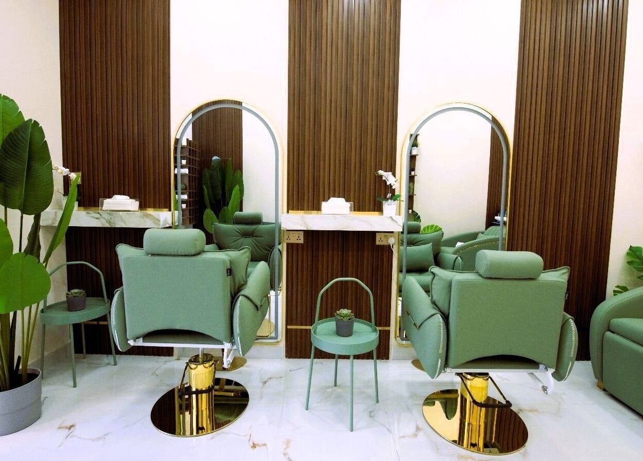 Elegant salon interior at Sally Queen Salon, Dubai, Dubai, AE, featuring modern chairs and stylish decor.