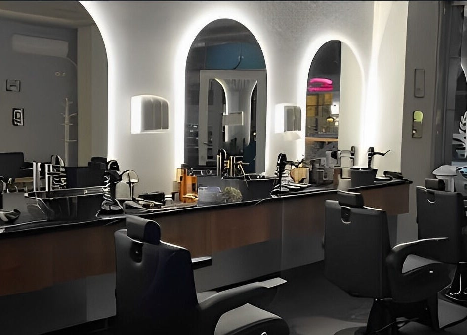 Stylish barbershop interior in Durrës, Qarku I Durrësit, AL with modern mirrors and chairs.