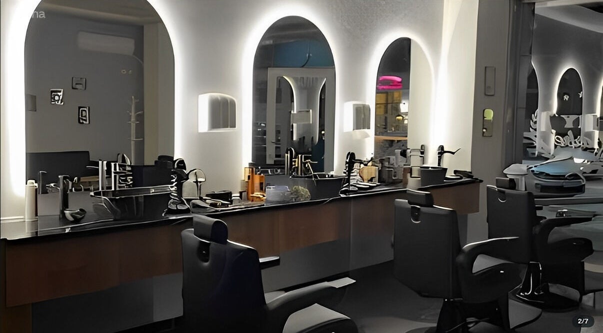 Stylish barbershop interior in Durrës, Qarku I Durrësit, AL with modern mirrors and chairs.