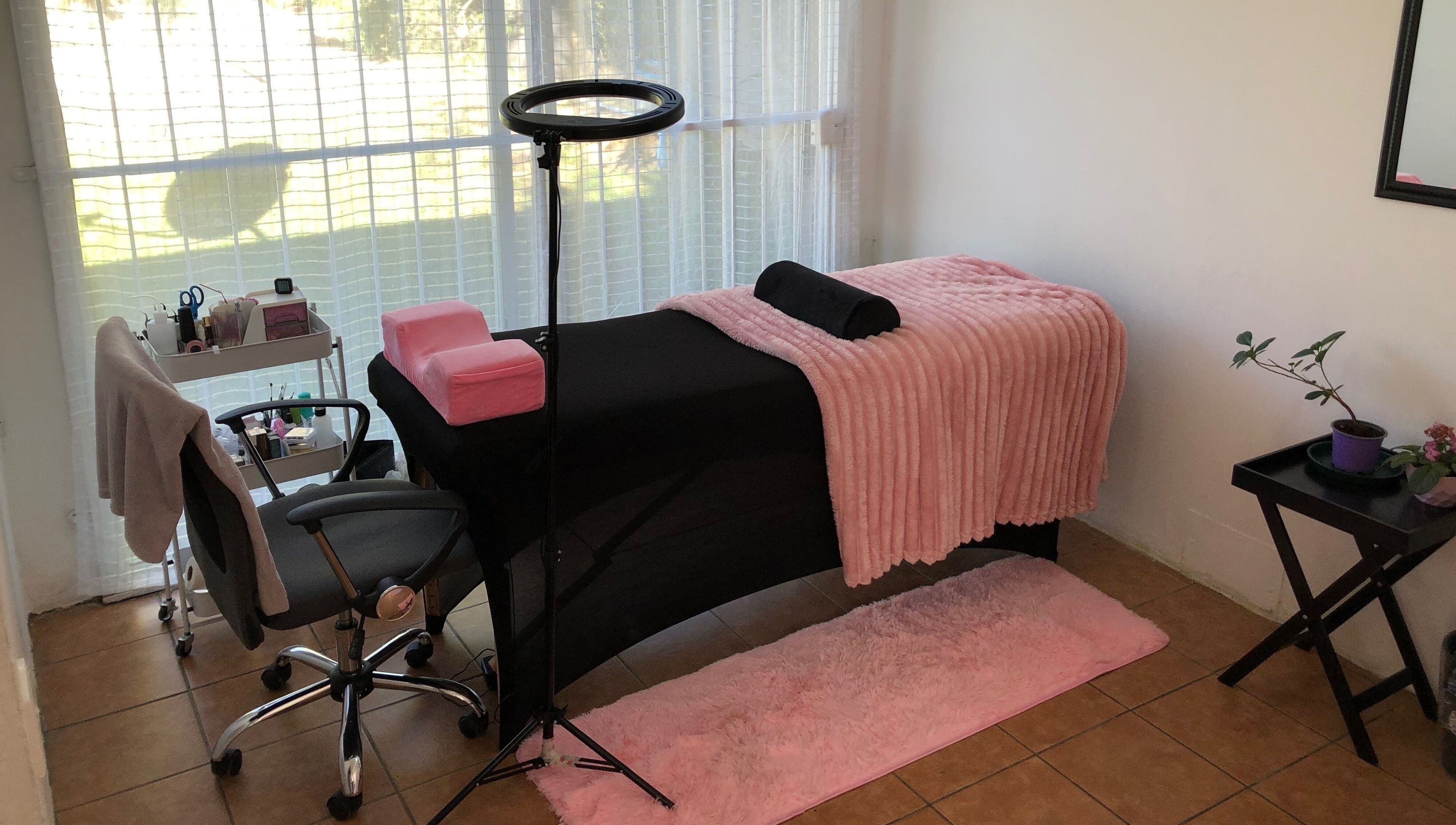 Cozy treatment room at Altered Studio, Edenvale, Gauteng, ZA with pink decor and modern furnishings.