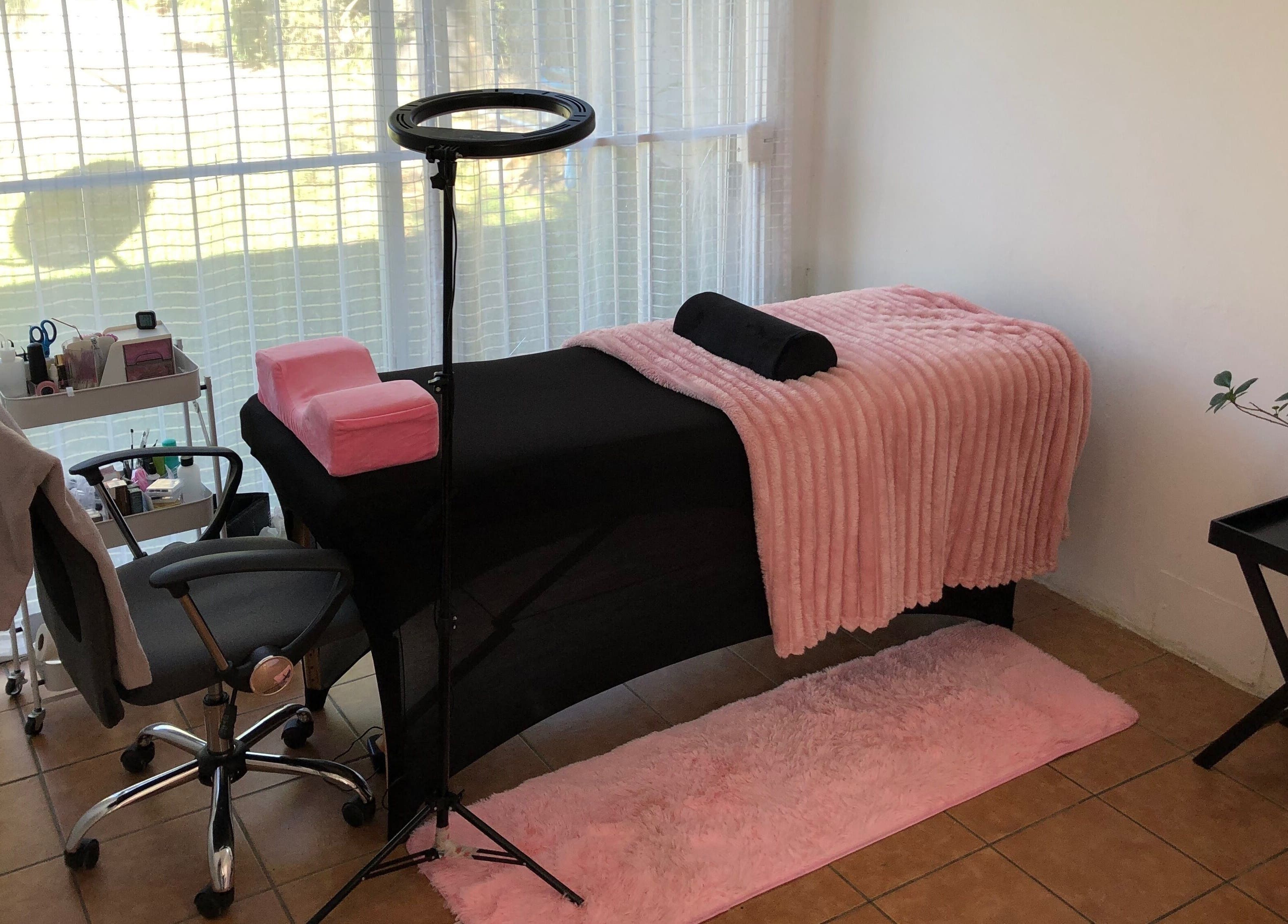 Cozy treatment room at Altered Studio, Edenvale, Gauteng, ZA with pink decor and modern furnishings.