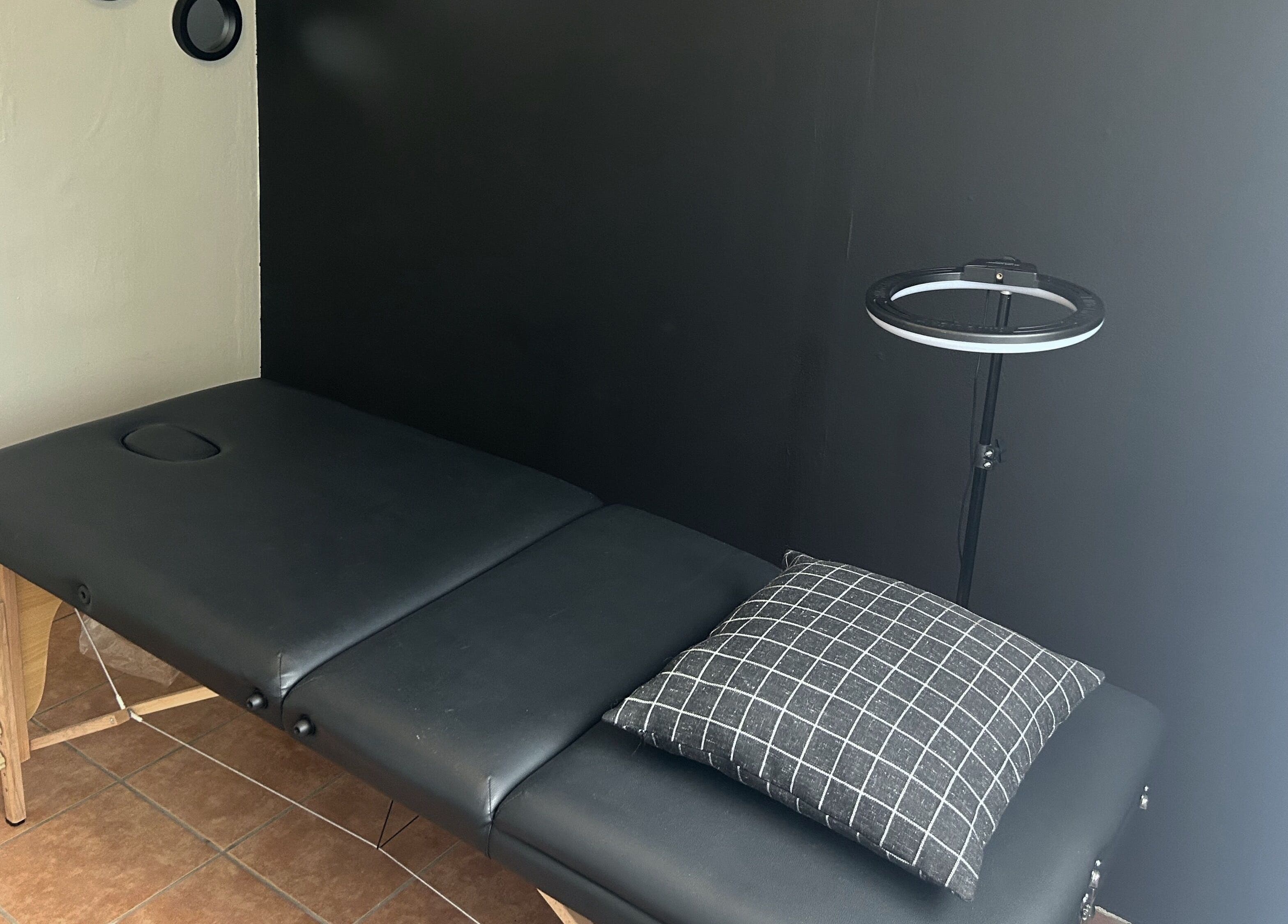 Massage table in Altered Studio, Edenvale, Gauteng, ZA, offering a serene wellness retreat.