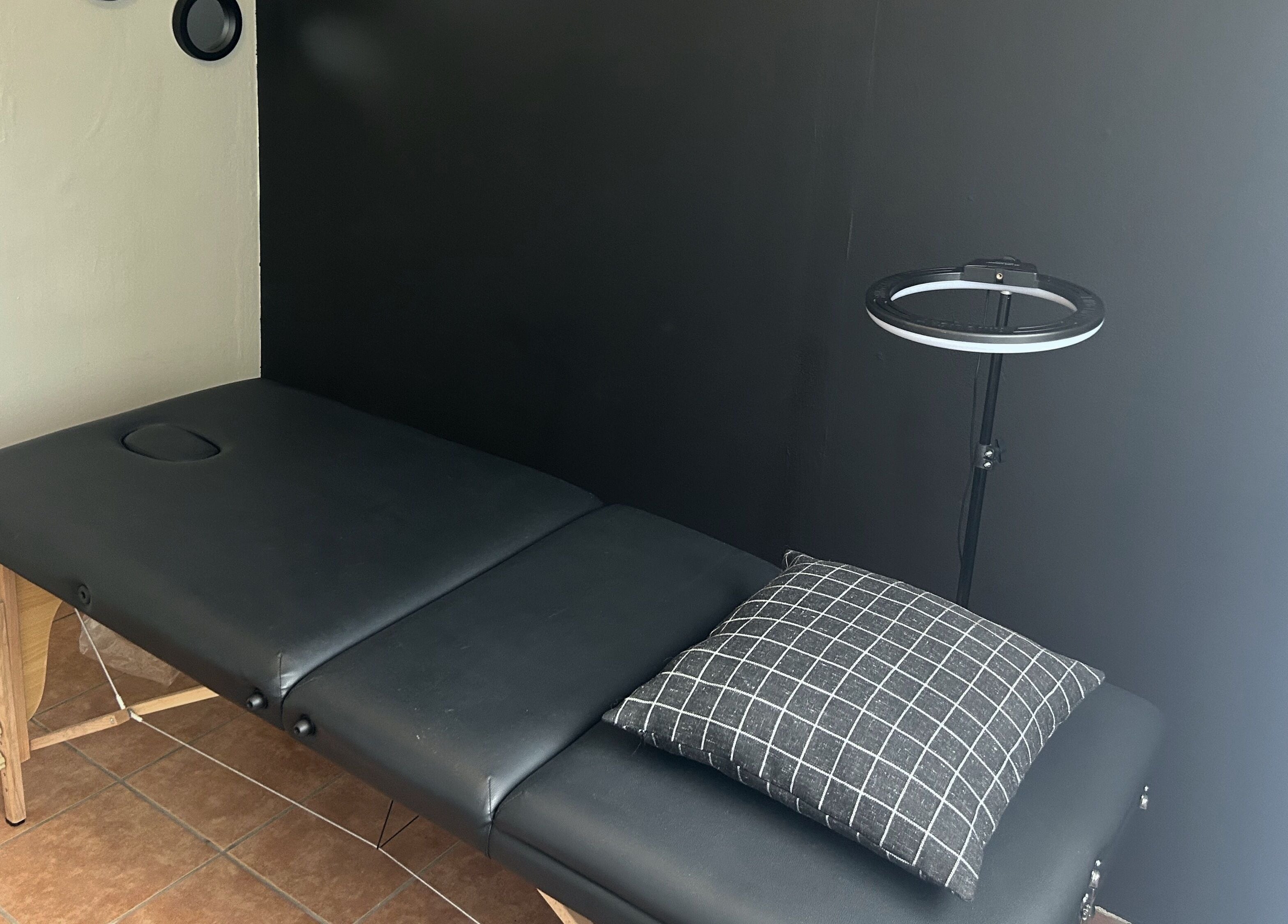 Massage table in Altered Studio, Edenvale, Gauteng, ZA, offering a serene wellness retreat.