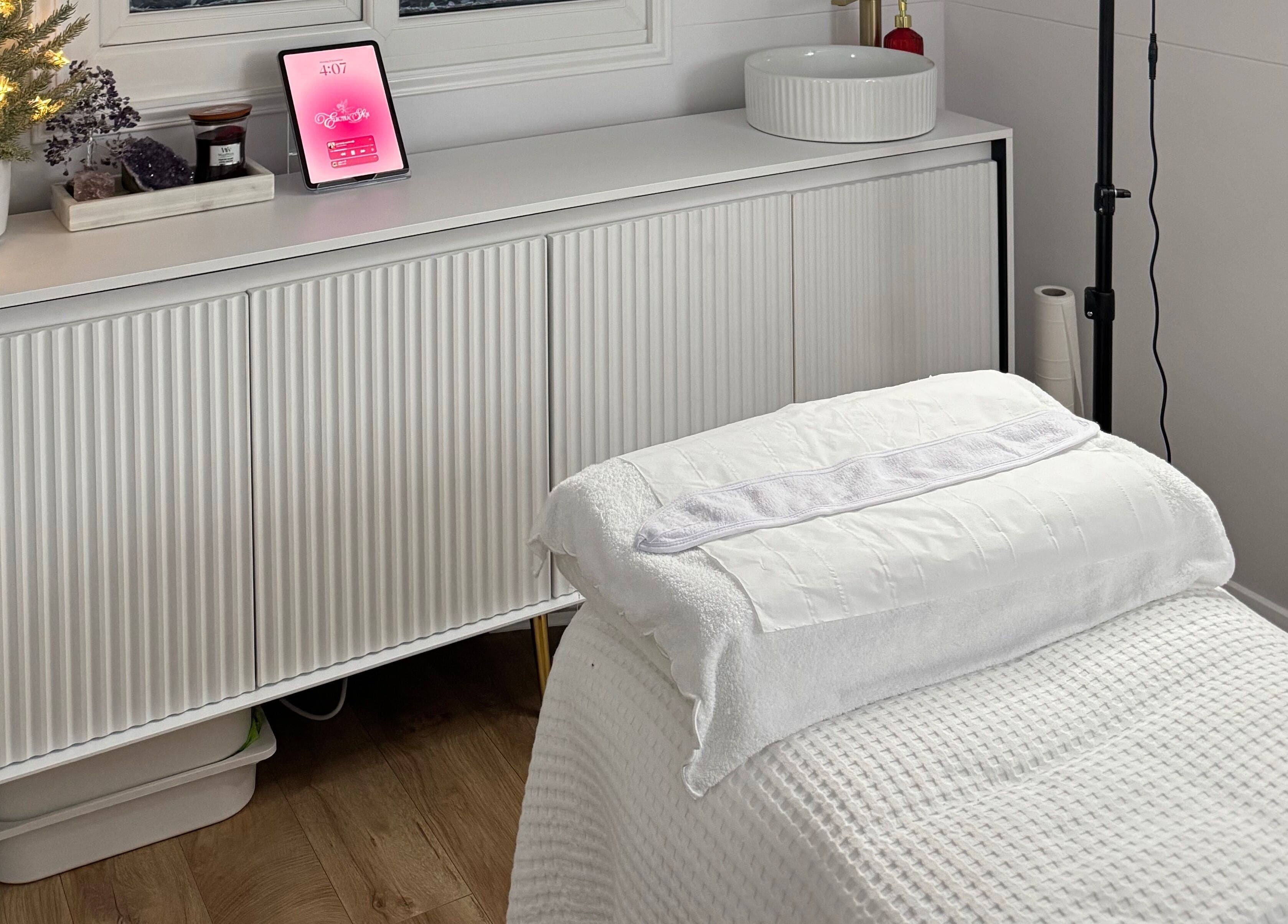 Relaxing massage room at Electra Skin in Upton, England, GB with cozy decor and soft lighting.