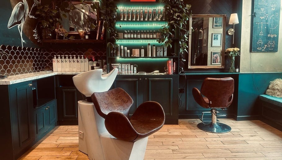 Elegant salon interior at Hair Gal Jaz, Edinburgh, Scotland, GB with modern seating and vibrant decor.