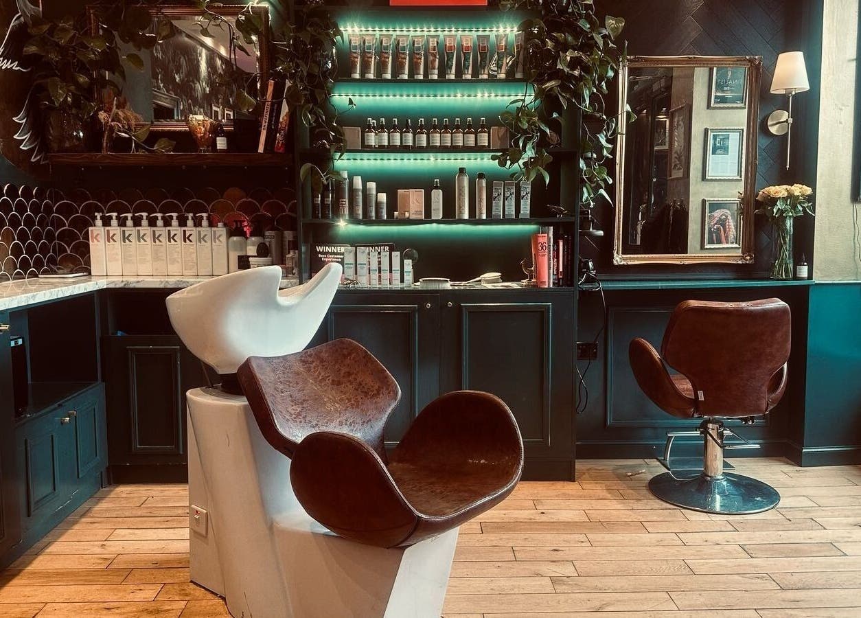 Elegant salon interior at Hair Gal Jaz, Edinburgh, Scotland, GB with modern seating and vibrant decor.