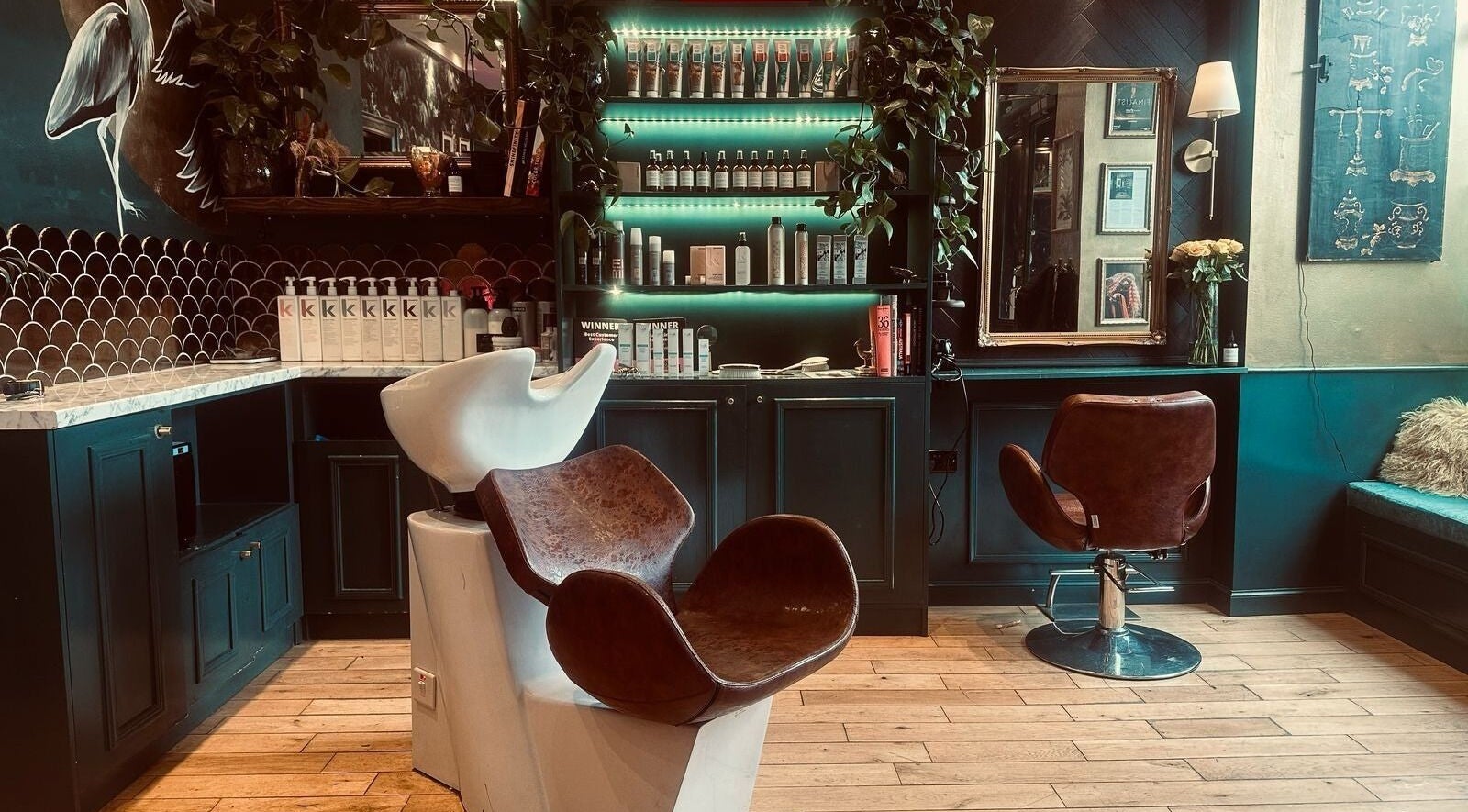 Elegant salon interior at Hair Gal Jaz, Edinburgh, Scotland, GB with modern seating and vibrant decor.