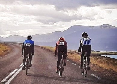 Three cyclists ride along a scenic road. Brian Spagnoletti, New York, New York, US.
