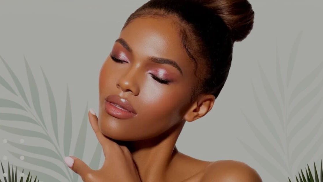 Model with radiant skin care at LOVESTETIC, Abingdon, England, GB against a botanical backdrop.