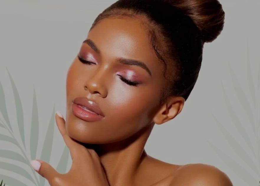 Model with radiant skin care at LOVESTETIC, Abingdon, England, GB against a botanical backdrop.