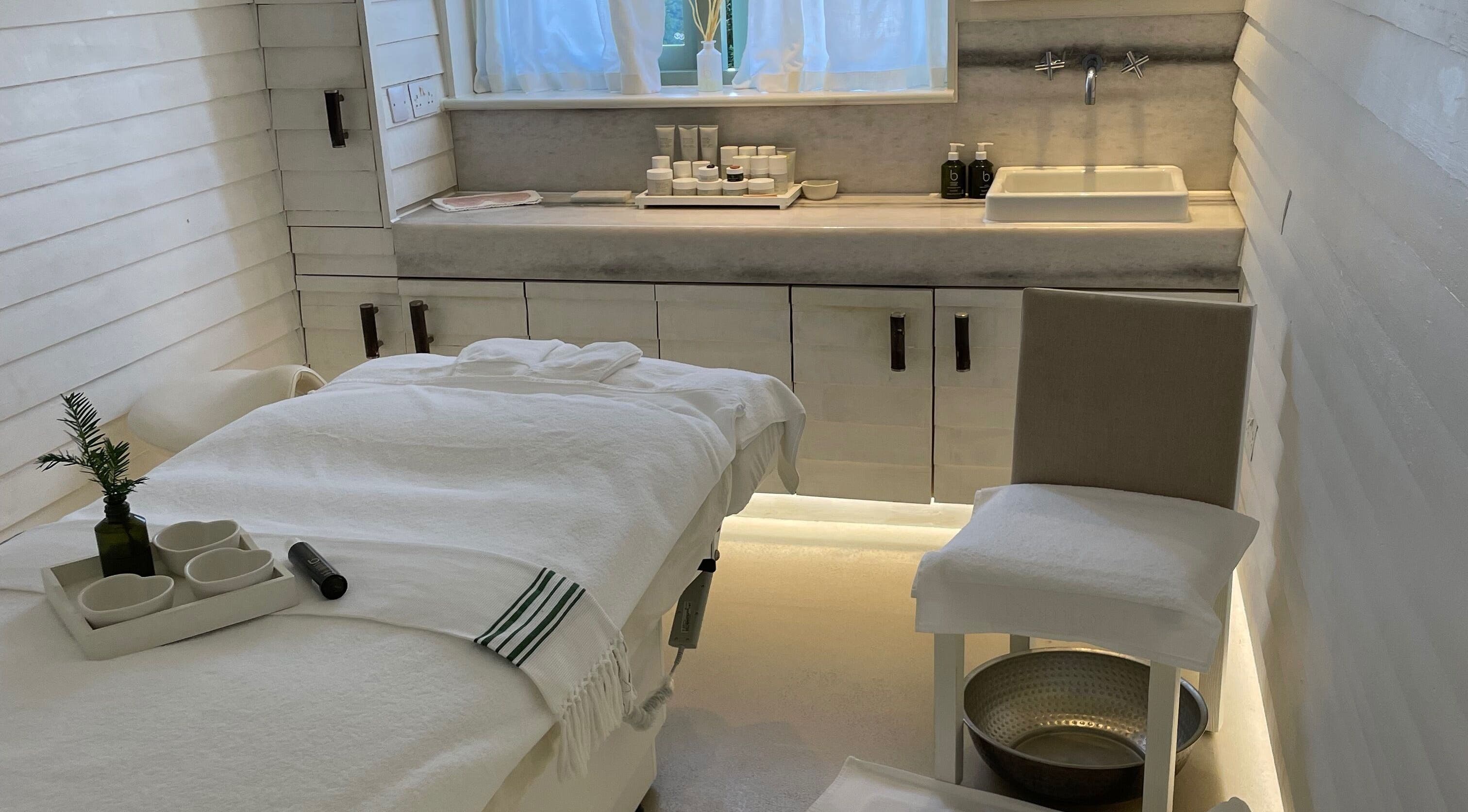 Tranquil massage room at LOVESTETIC, Abingdon, England, GB featuring a cozy bed and soothing decor.