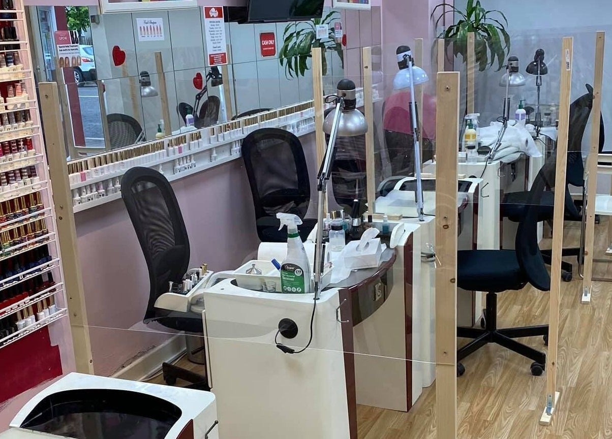 Chic nail salon interior at New Look Nails and Beauty, Newbridge, County Kildare, IE with polish display.