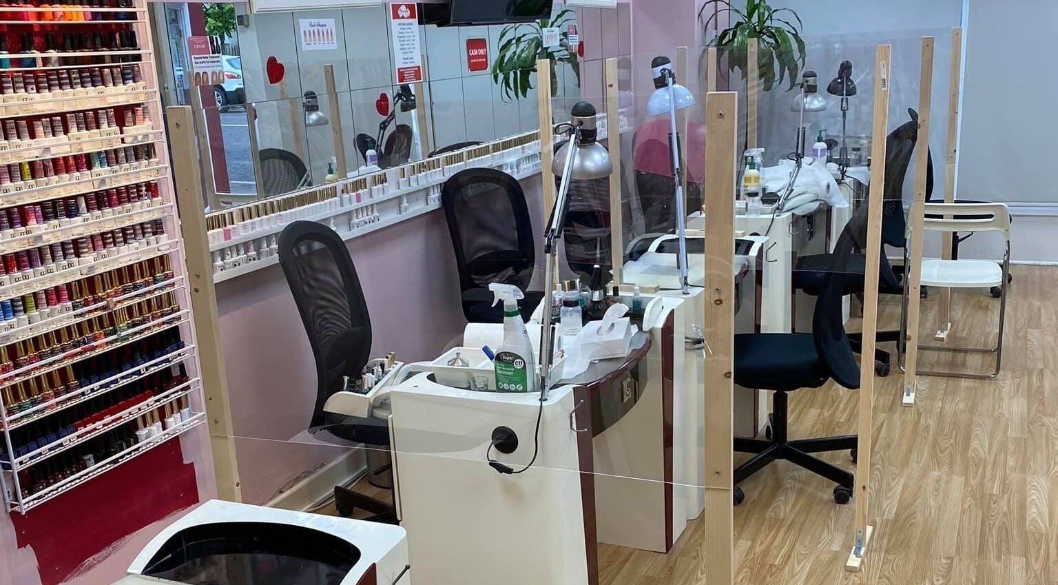 Chic nail salon interior at New Look Nails and Beauty, Newbridge, County Kildare, IE with polish display.