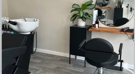 Modern salon chair and mirror at Izzy Ferguson hair in Ilkeston, England, GB.