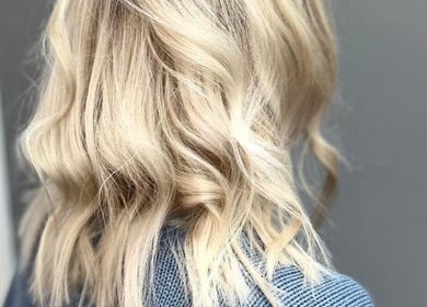 Blonde hair styled in soft curls at The Livingroom Oxford, Oxford, England, GB.