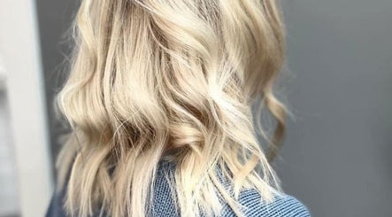 Blonde hair styled in soft curls at The Livingroom Oxford, Oxford, England, GB.
