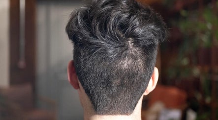 Back view of a stylish men's haircut at The Livingroom Oxford, Oxford, England, GB.