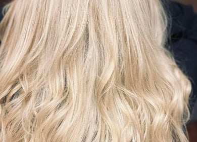 Blonde wavy hairstyle at The Livingroom Oxford, Oxford, England, GB, showcasing vibrant hair care.