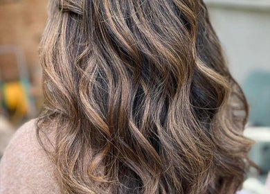 Elegant wavy hairstyle at The Livingroom Oxford, Oxford, England, GB. Perfect for stylish, sophisticated looks.