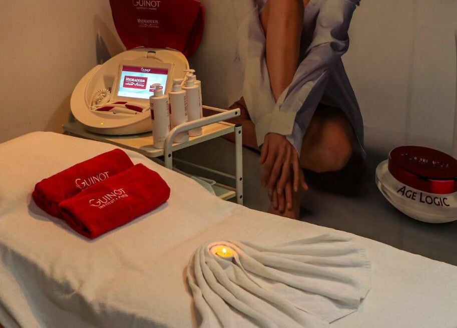 Elegant treatment room at Only You Salon in Dubai, AE with plush towels and beauty products.