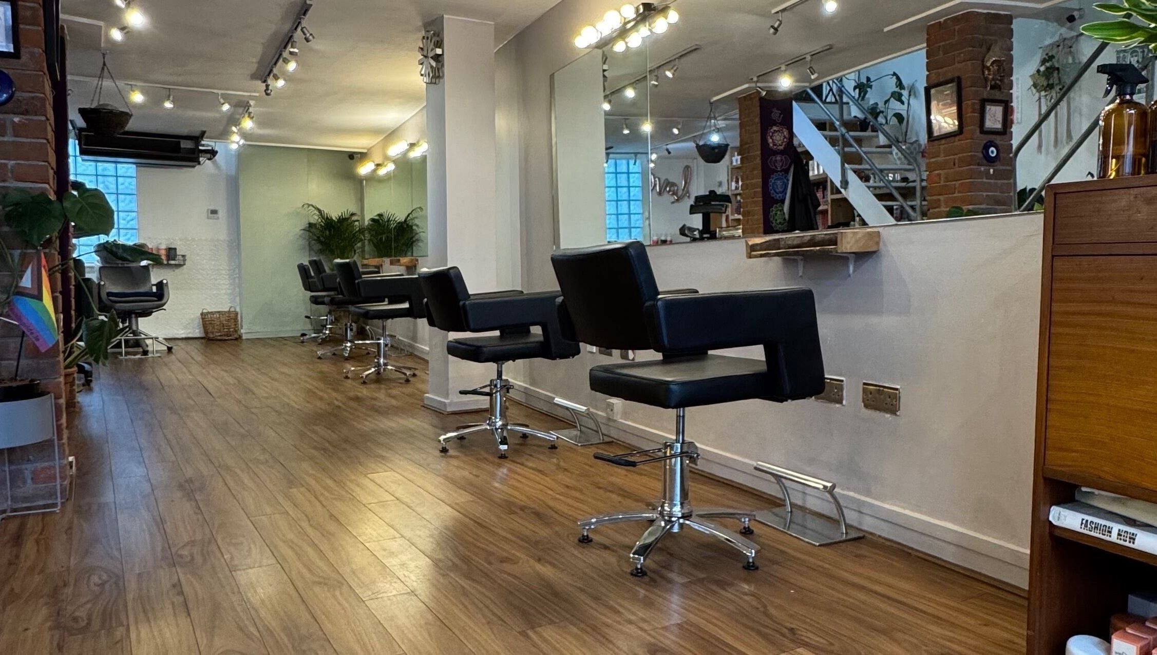 Elegant interior of The Studio by Marco Dias in Dublin, County Dublin, IE featuring sleek salon chairs and mirrors.