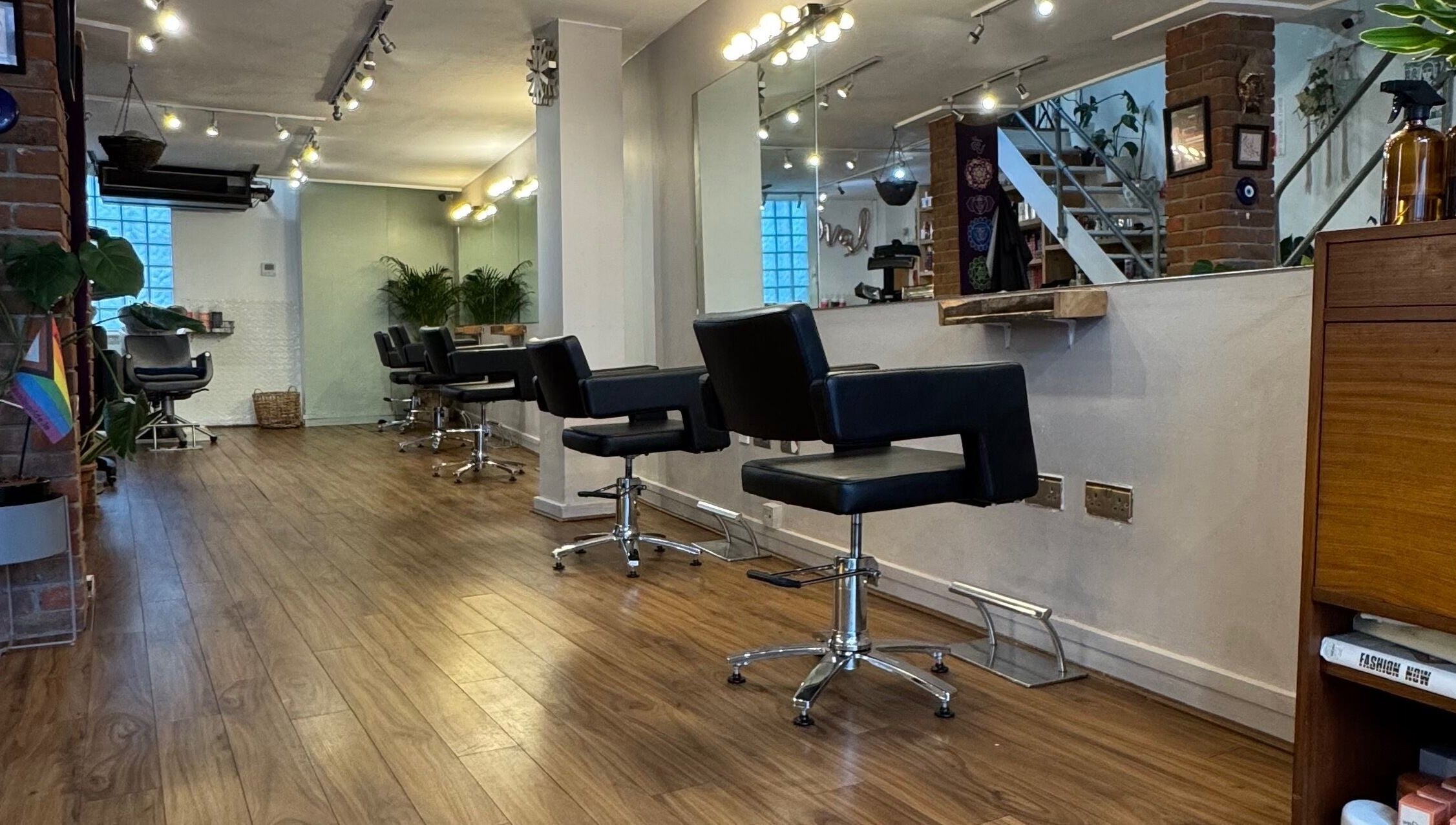 Elegant interior of The Studio by Marco Dias in Dublin, County Dublin, IE featuring sleek salon chairs and mirrors.